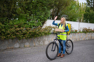 woman on a bike delivering a package 